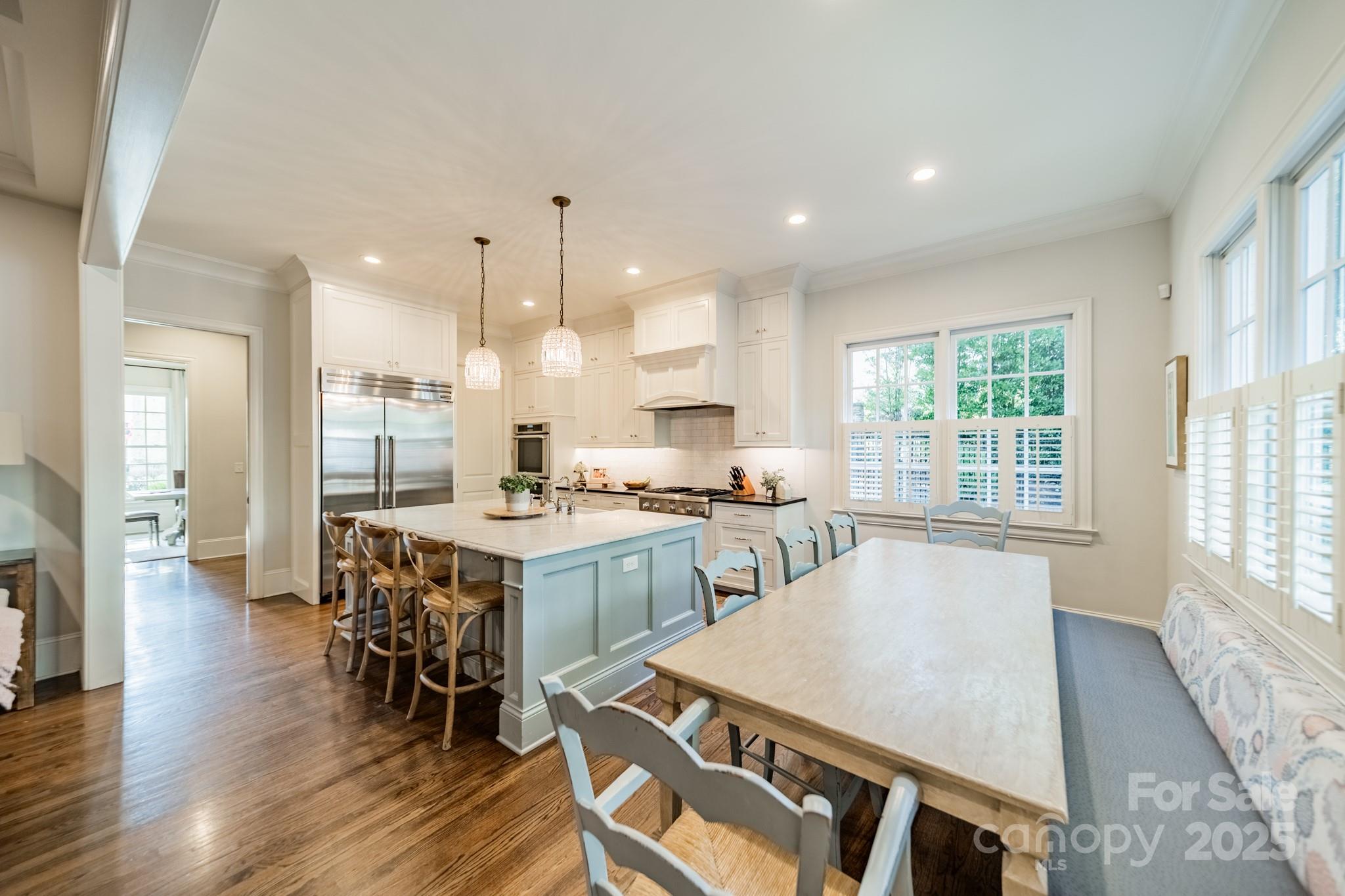 4141 Tyng Way Charlotte, NC 28211 - Photo 11 of 48 a large kitchen with a table and chairs