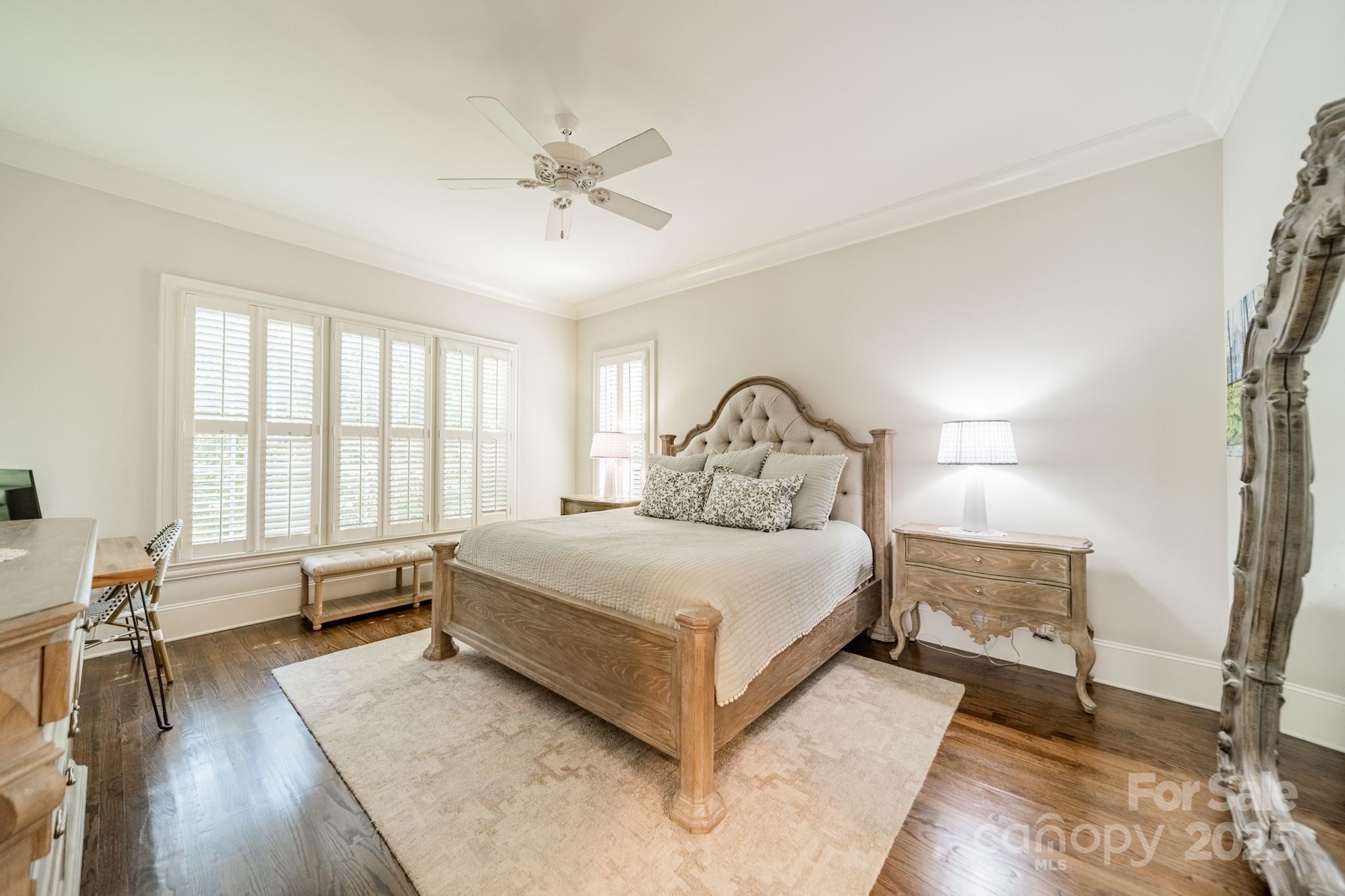 4141 Tyng Way Charlotte, NC 28211 - Photo 17 of 48 a bedroom with a large bed and wooden floor