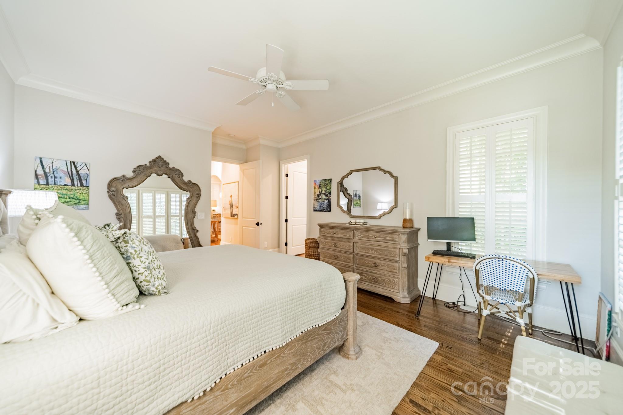 4141 Tyng Way Charlotte, NC 28211 - Photo 19 of 48 a bedroom with a bed large window and chair