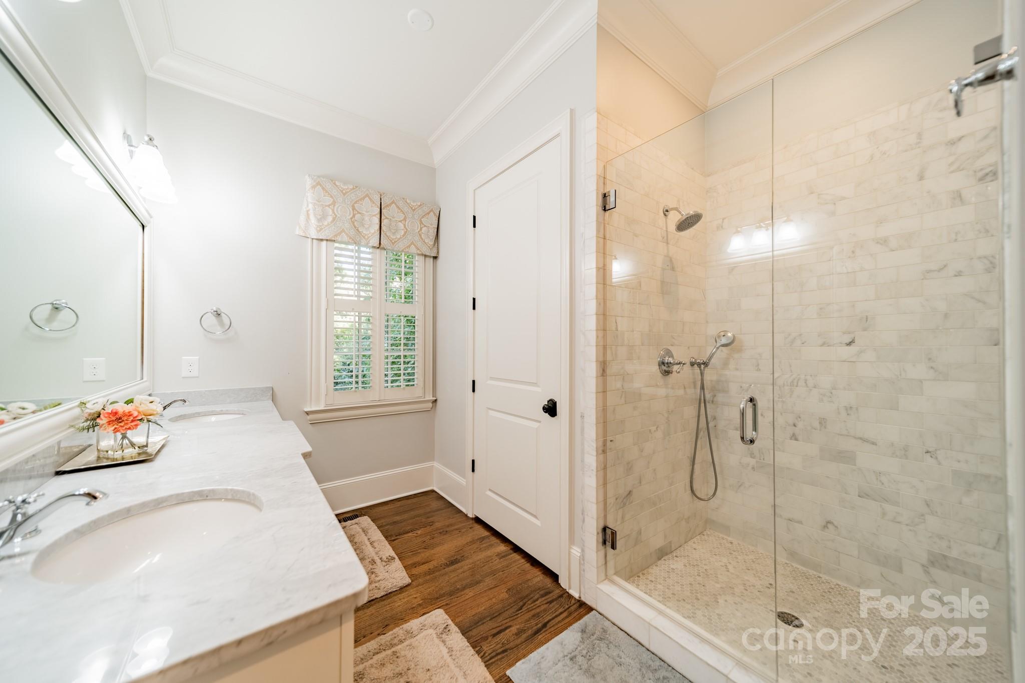 4141 Tyng Way Charlotte, NC 28211 - Photo 21 of 48 a spacious bathroom with a granite countertop shower a sink and a mirror