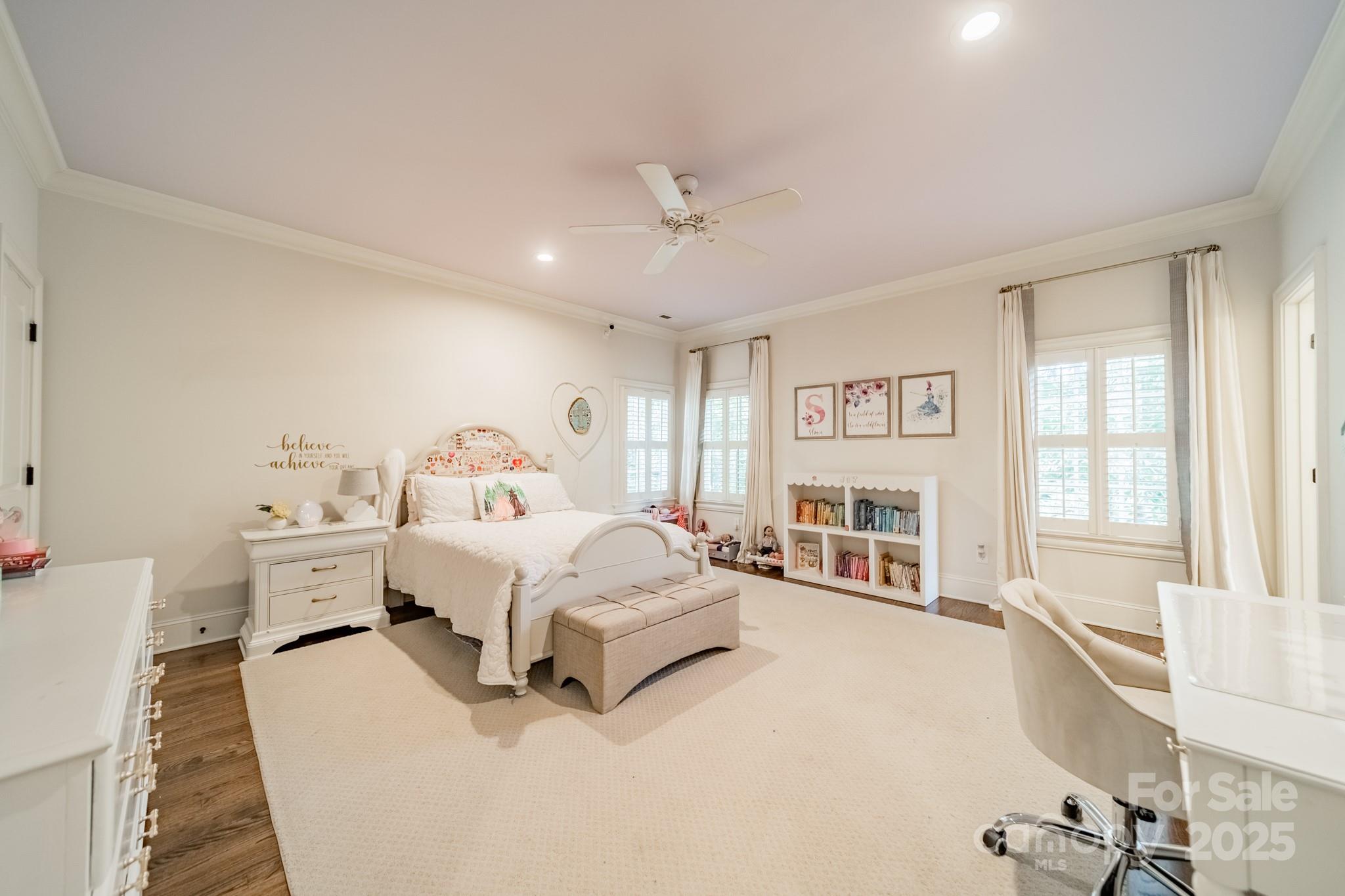 4141 Tyng Way Charlotte, NC 28211 - Photo 26 of 48 a spacious bedroom with a bed next to a large window with the outer view