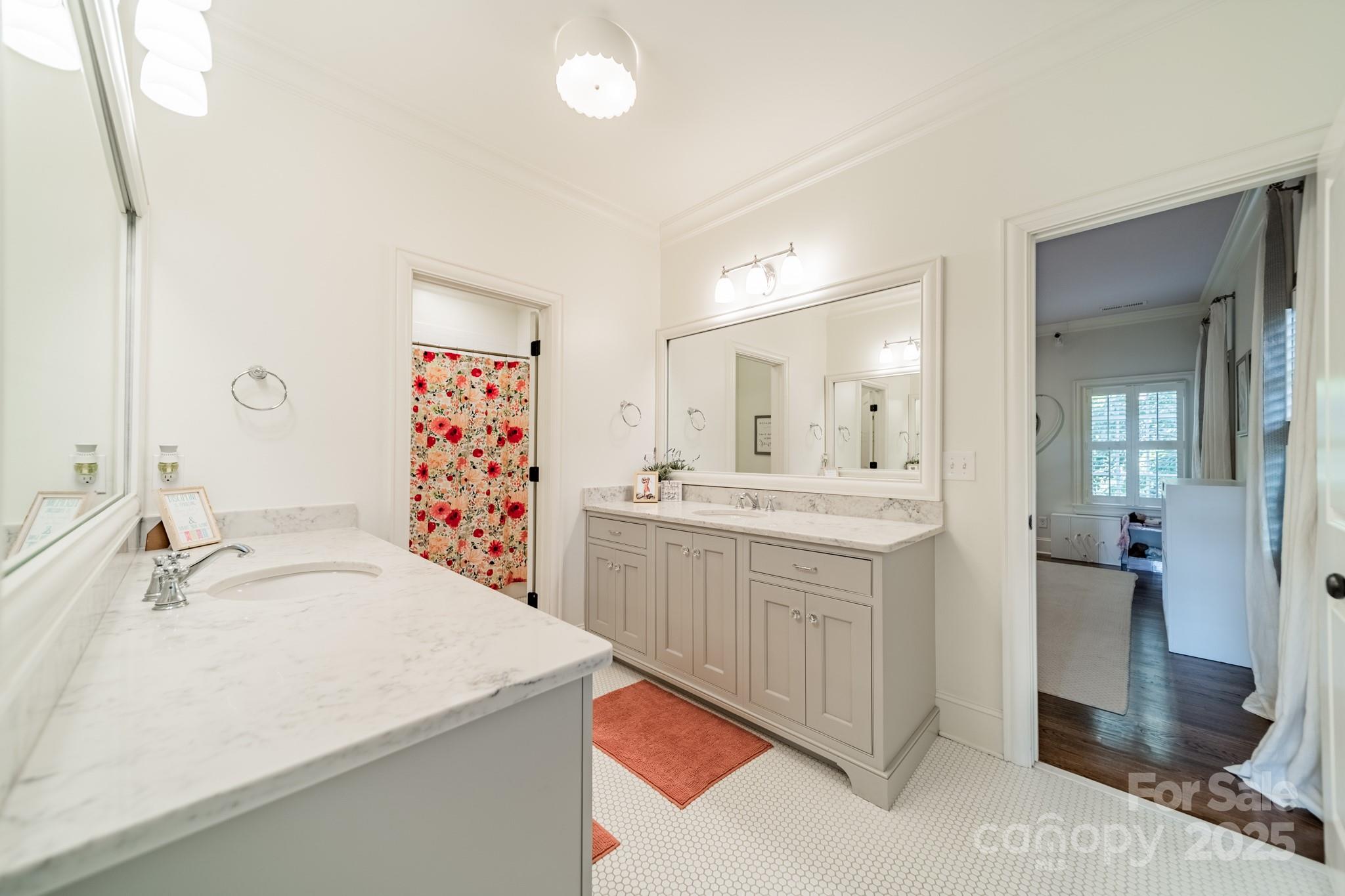 4141 Tyng Way Charlotte, NC 28211 - Photo 30 of 48 a bathroom with a sink a mirror and a shower