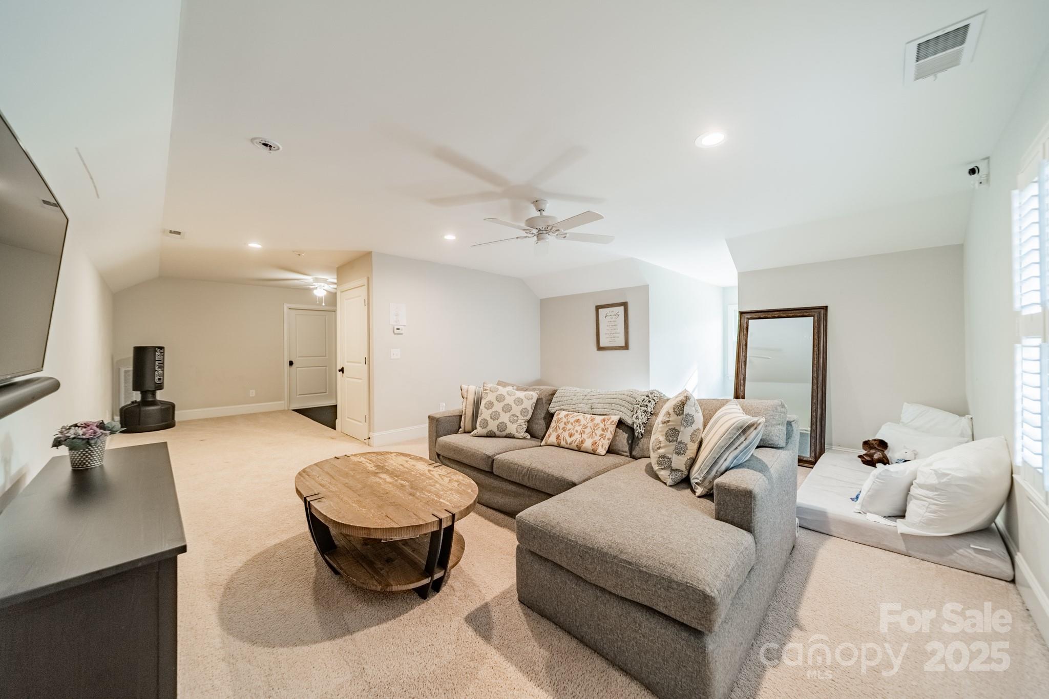 4141 Tyng Way Charlotte, NC 28211 - Photo 33 of 48 a living room with furniture and a large mirror