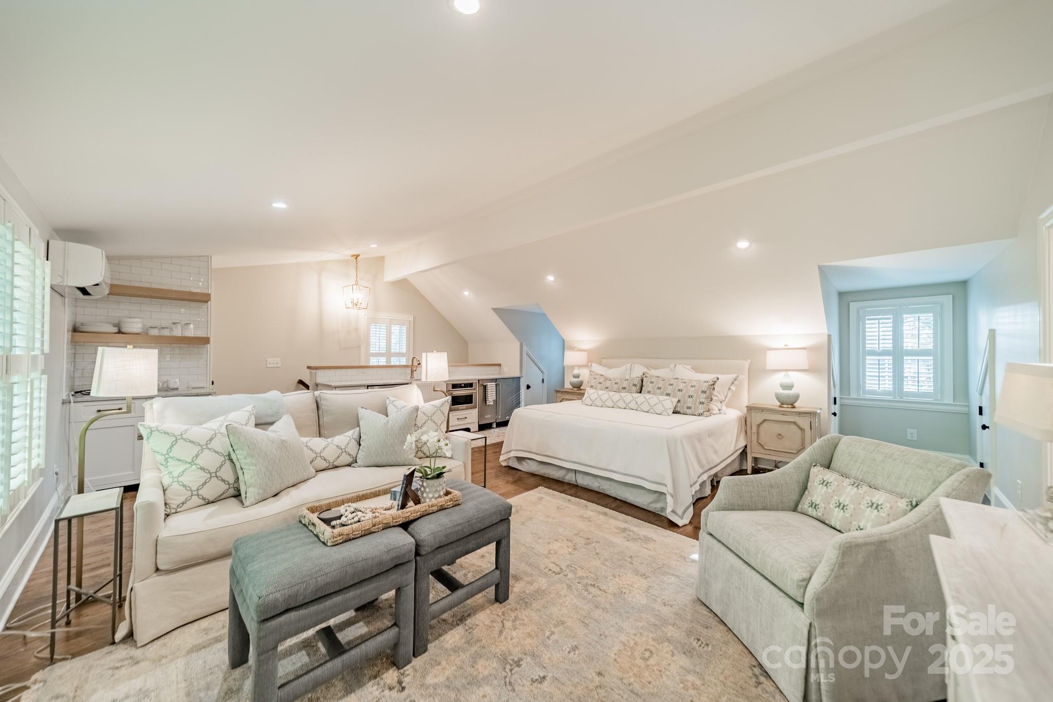 4141 Tyng Way Charlotte, NC 28211 - Photo 36 of 48 a bed room with furniture and a large mirror