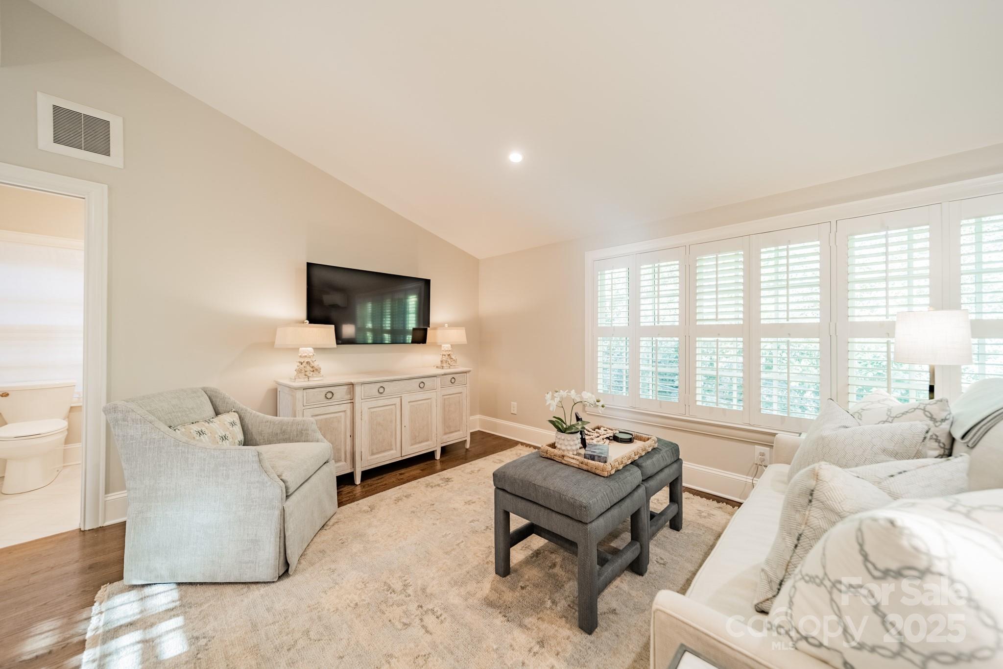 4141 Tyng Way Charlotte, NC 28211 - Photo 37 of 48 a living room with furniture a flat screen tv and a large window