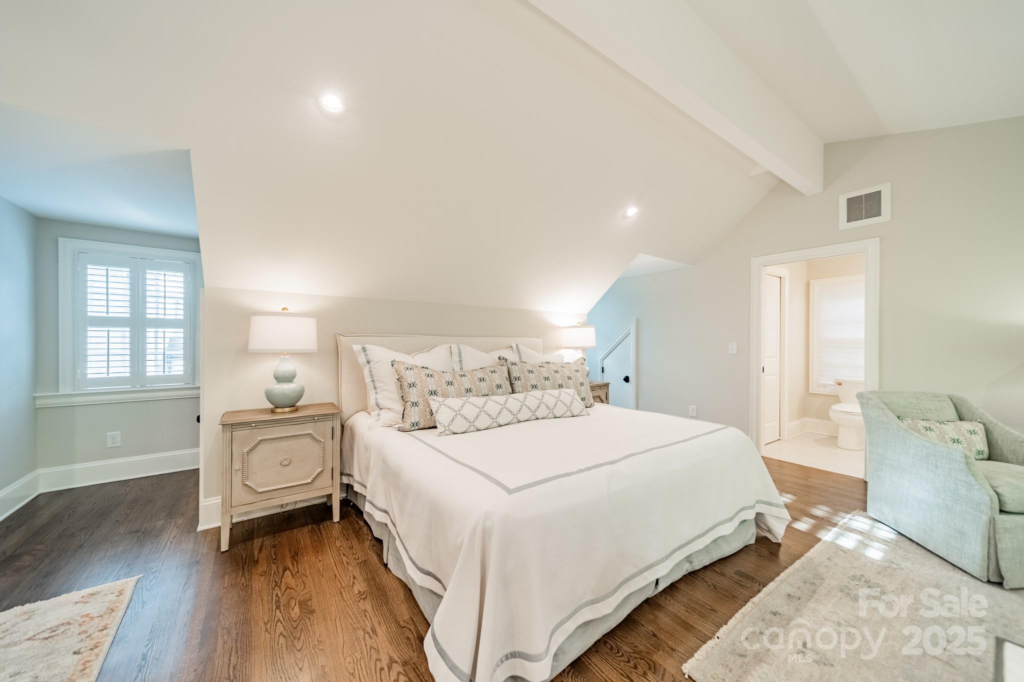 4141 Tyng Way Charlotte, NC 28211 - Photo 42 of 48 a bedroom with a bed and wooden floor