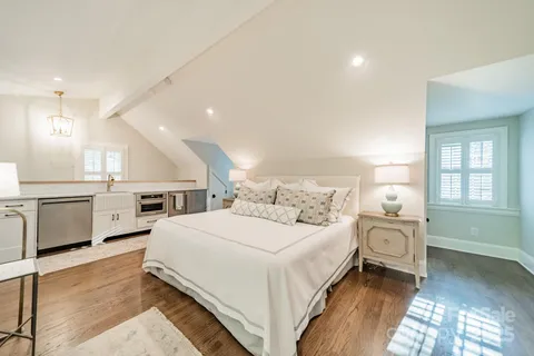 a bedroom with a bed and a view in closet