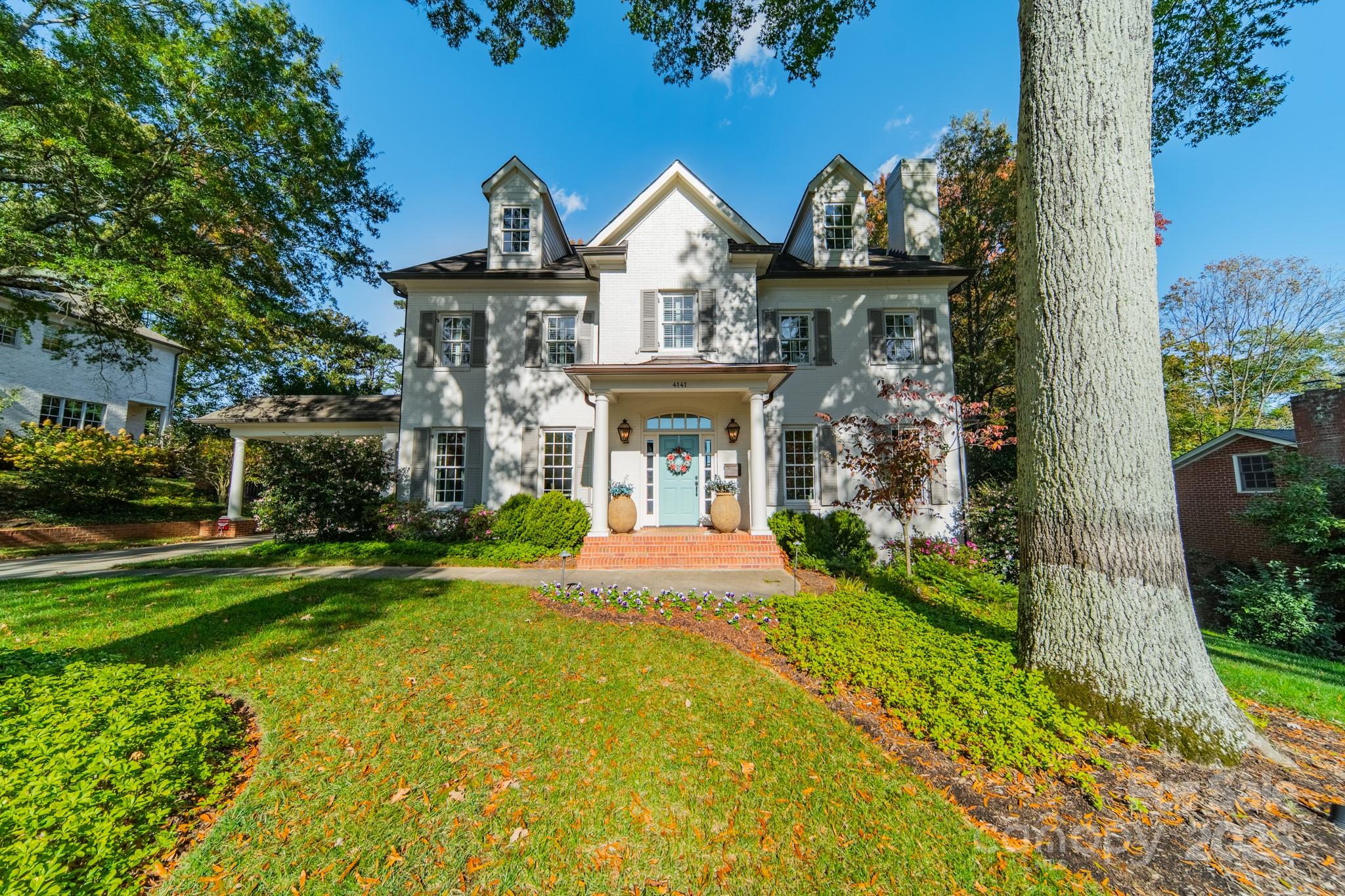 4141 Tyng Way Charlotte, NC 28211 - Photo 48 of 48 a front view of a house with garden