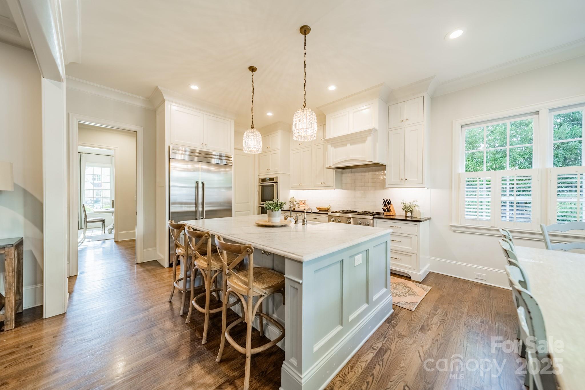 4141 Tyng Way Charlotte, NC 28211 - Photo 10 of 48 a large kitchen with kitchen island a large island in it