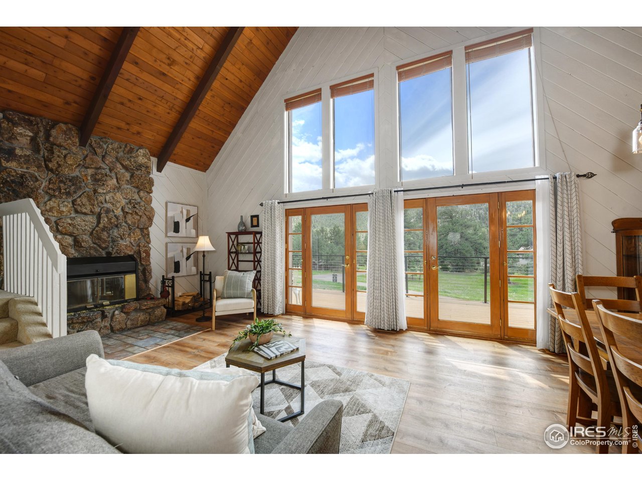 40 Hopi Court Lyons, CO 80540 - Photo 2 of 40 a living room with furniture and a floor to ceiling window