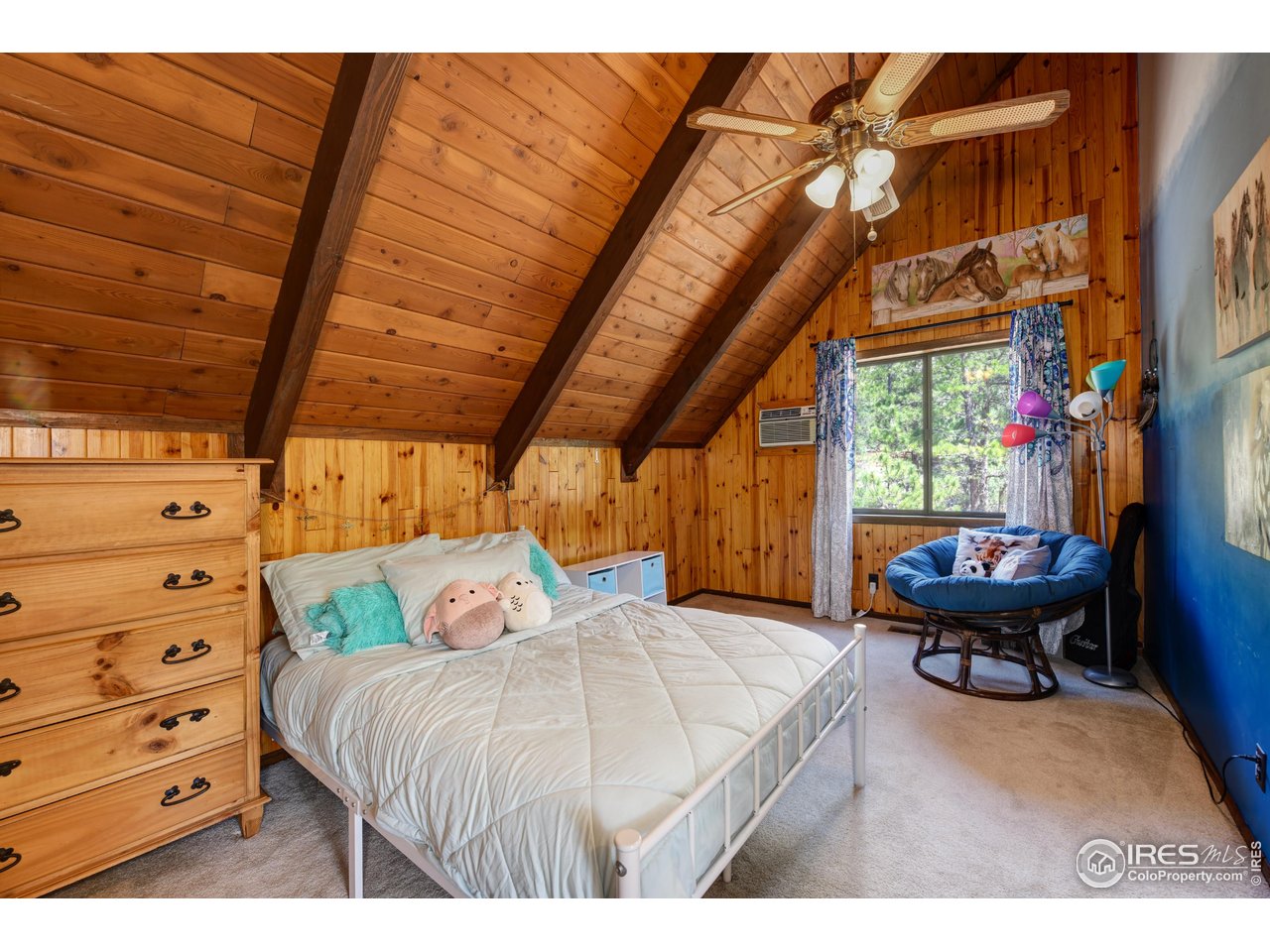 40 Hopi Court Lyons, CO 80540 - Photo 22 of 40 a bed room with a bed and a chair