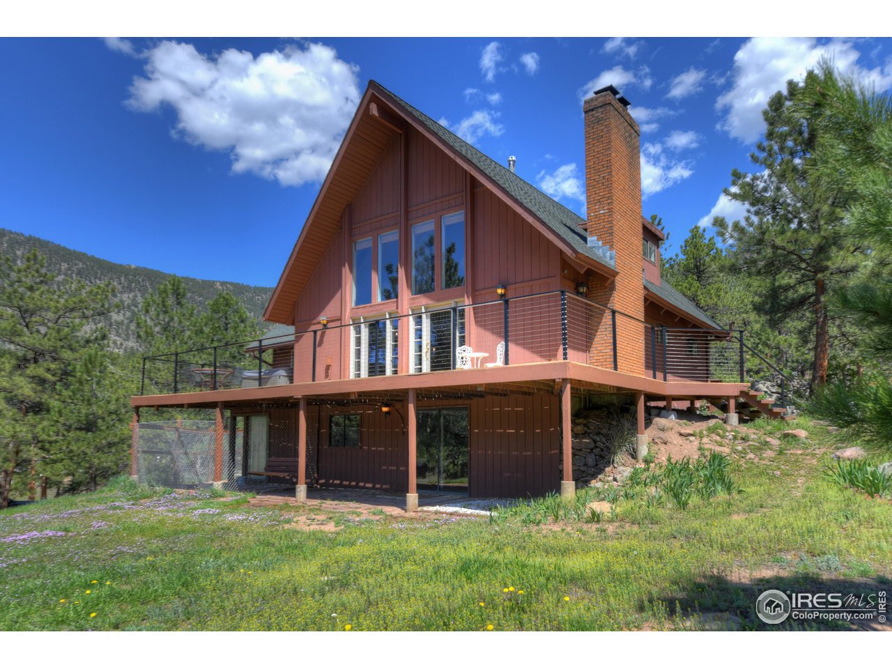 40 Hopi Court Lyons, CO 80540 - Photo 27 of 40 a front view of a house with a garden