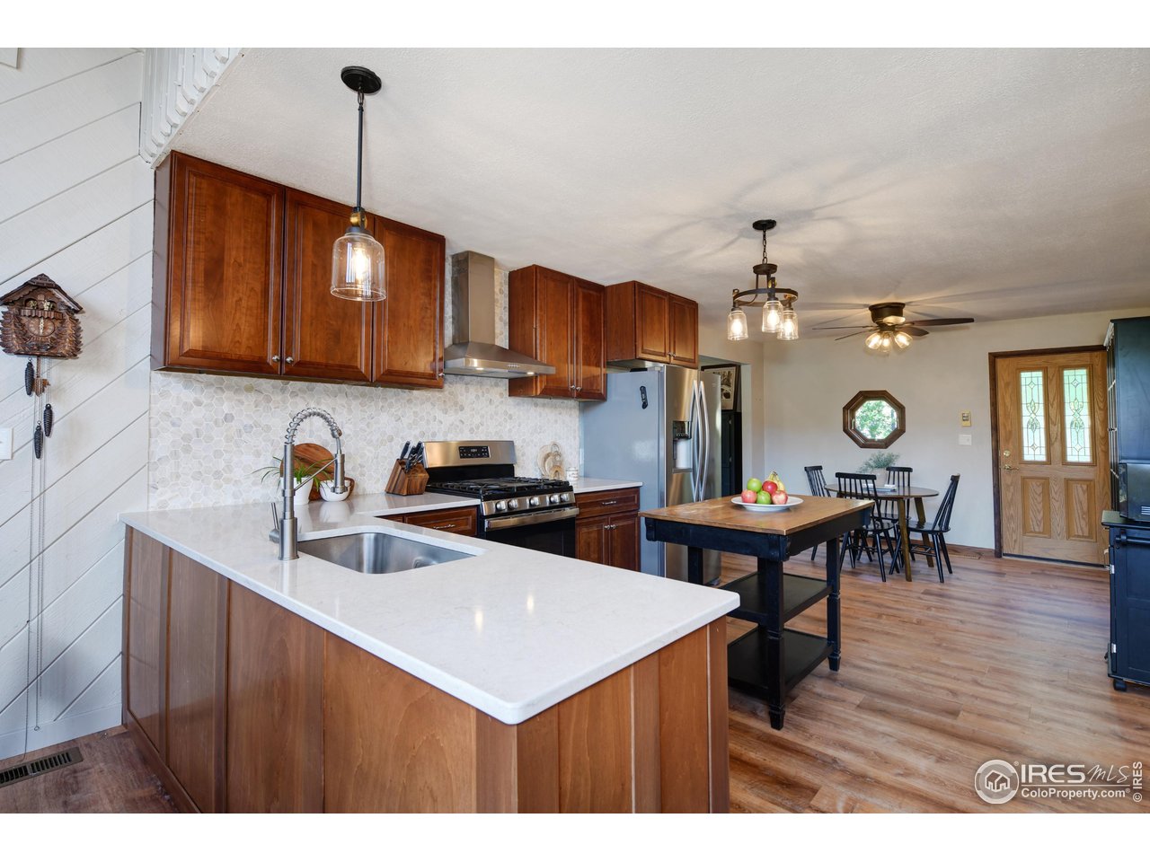 40 Hopi Court Lyons, CO 80540 - Photo 7 of 40 a kitchen with a sink a cabinets and chairs