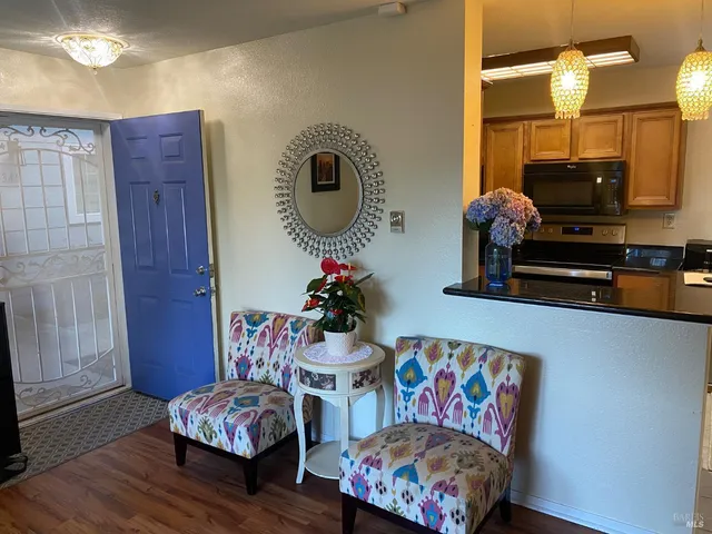 a kitchen with stainless steel appliances a stove sink and a microwave