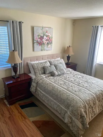 a balcony with furniture and flowers