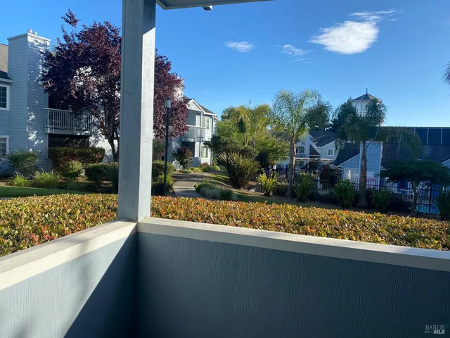 a view of swimming pool with outdoor seating and plants