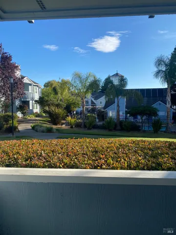 a view of a dining room with furniture and window
