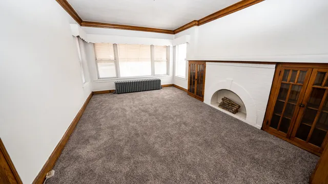 a kitchen with stainless steel appliances a refrigerator a sink a stove a microwave a counter top and cabinets