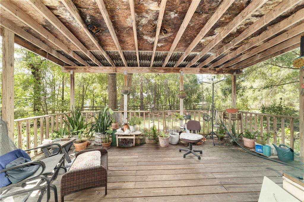 10630 Northwest 10th Street Road Ocala, FL 34482 - Photo 19 of 29 a living room with patio furniture and a large window