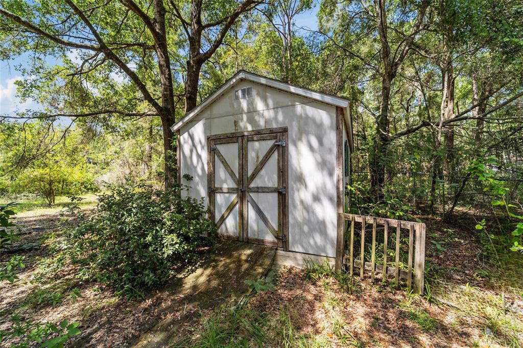 10630 Northwest 10th Street Road Ocala, FL 34482 - Photo 25 of 29 a backyard of a house with lots of green space