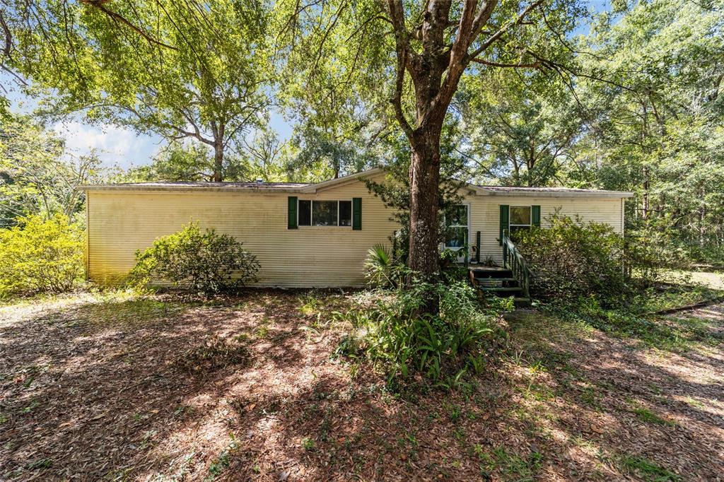 10630 Northwest 10th Street Road Ocala, FL 34482 - Photo 3 of 29 a house view with a backyard space