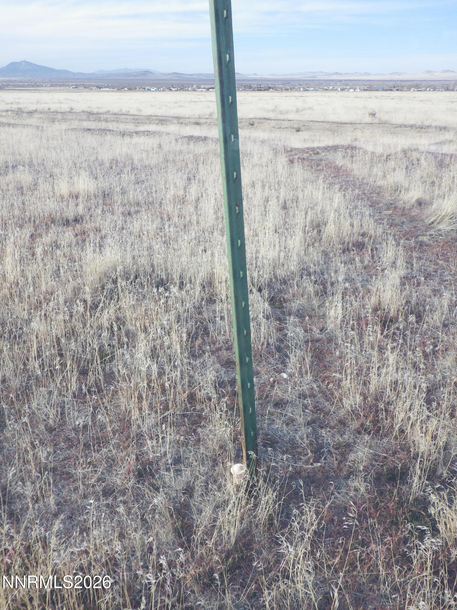 0 Ruiz Road, Unit 922014 Winnemucca, NV 89445 - Photo 6 of 8 a view of a dry yard next to a road