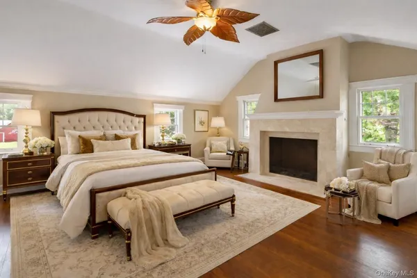 a bedroom with a bed and a fireplace