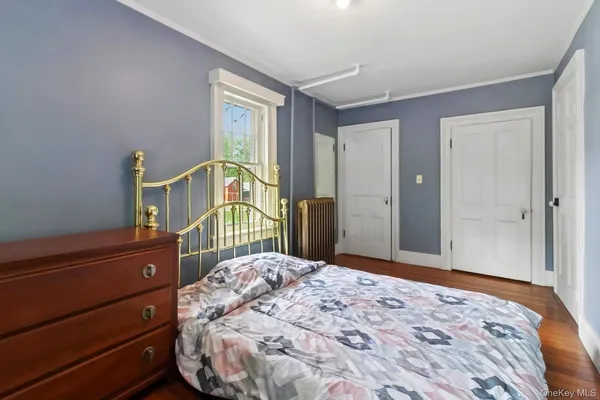 a view of a trees and barn in the back yard