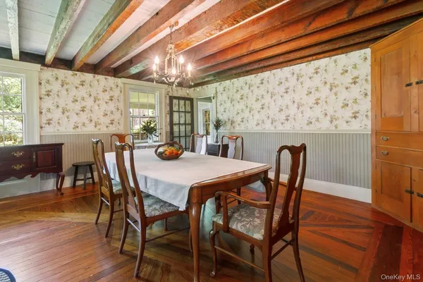 a kitchen with stainless steel appliances granite countertop a sink and a large window