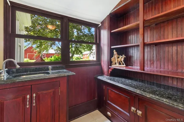 a bathroom with a sink a toilet and bathtub