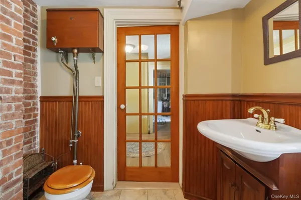a bathroom with a sink and a large mirror