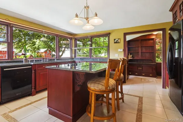 a view of a dining room with furniture window and outside view