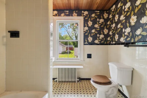 a bathroom with a bathtub and shower