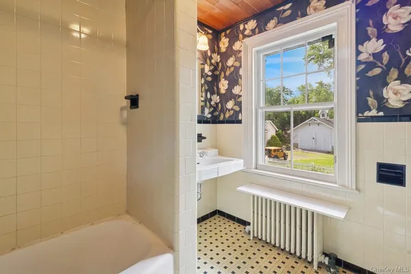 a view of a hallway with washer and dryer