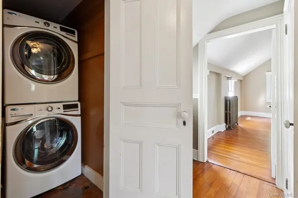 a view of a street with trees and cars