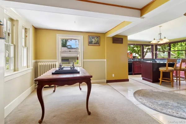 a view of a livingroom with furniture window and wooden floor