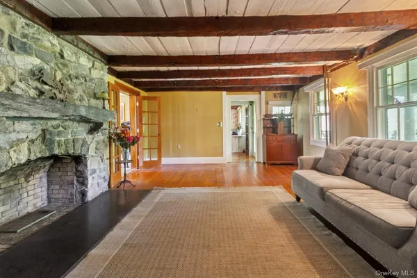 a lobby with furniture and a fireplace