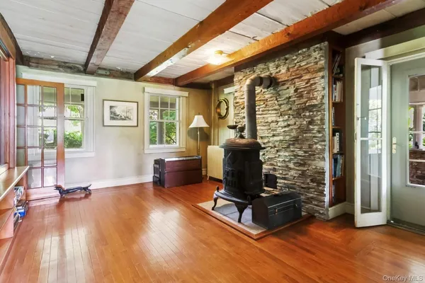 a living room with furniture windows and a fireplace