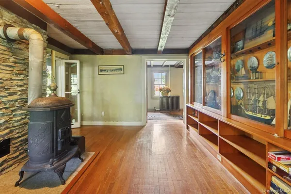a view of an entryway with wooden floor