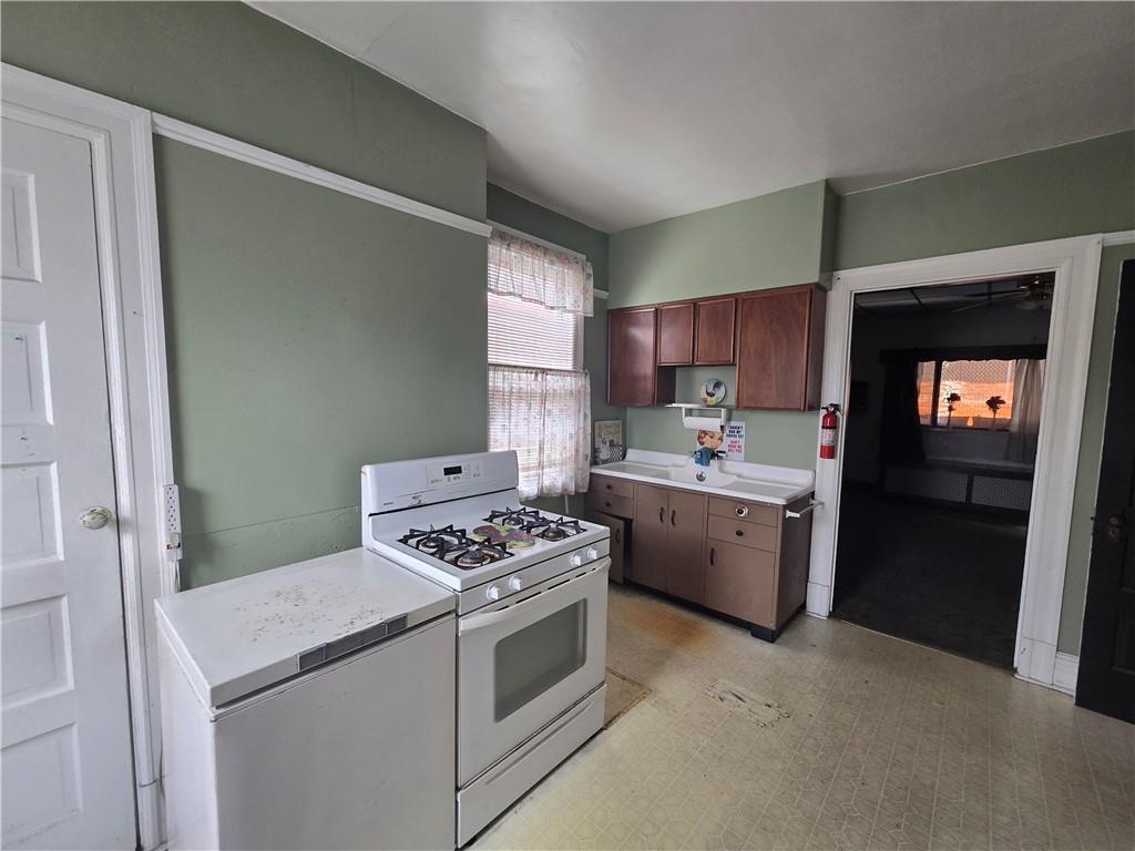 1490 Island Avenue McKees Rocks, PA 15136 - Photo 10 of 30 a kitchen with a stove and a refrigerator