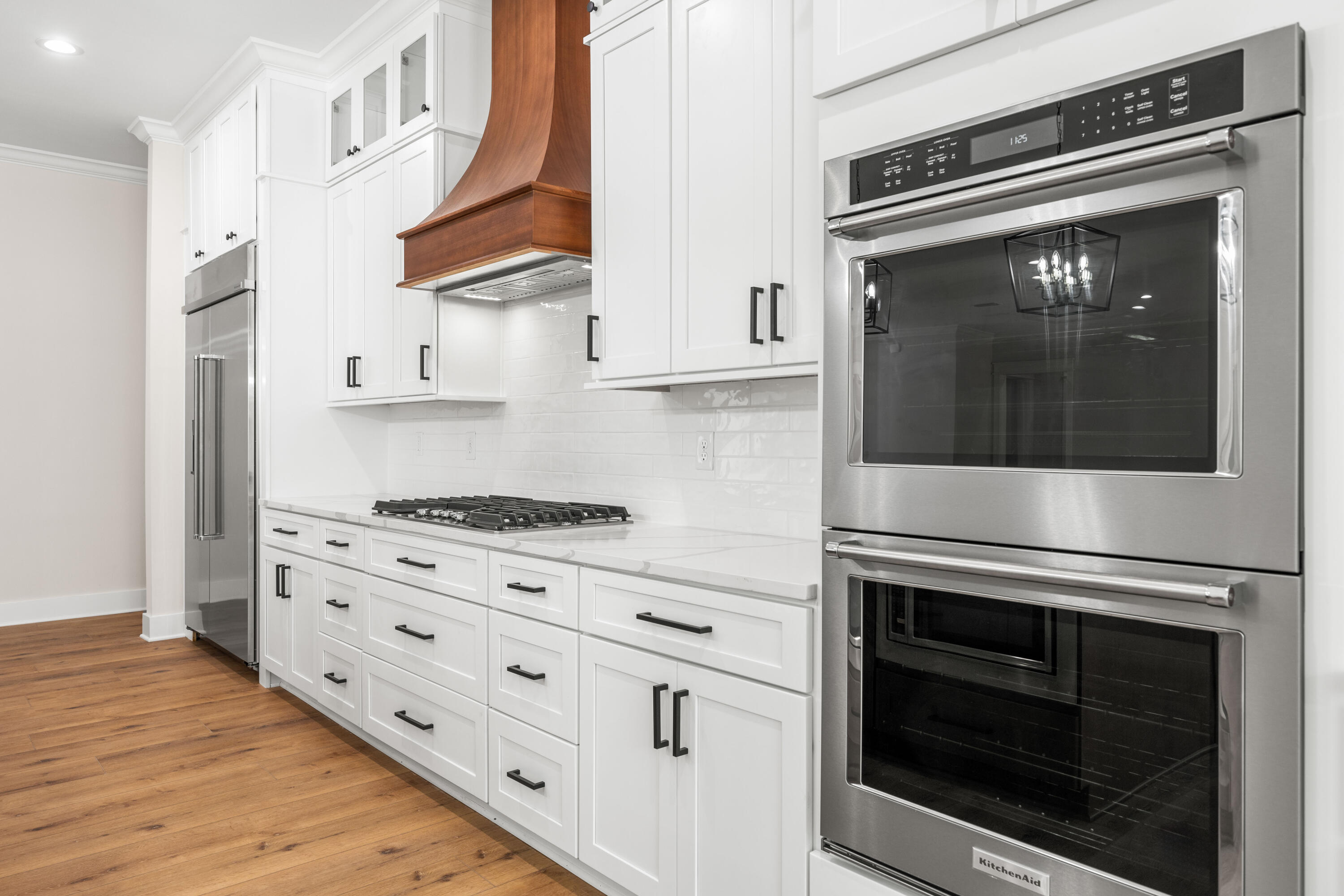 177 Harmony Way Freeport, FL 32439 - Photo 11 of 87 a kitchen with stainless steel appliances granite countertop a stove and a microwave