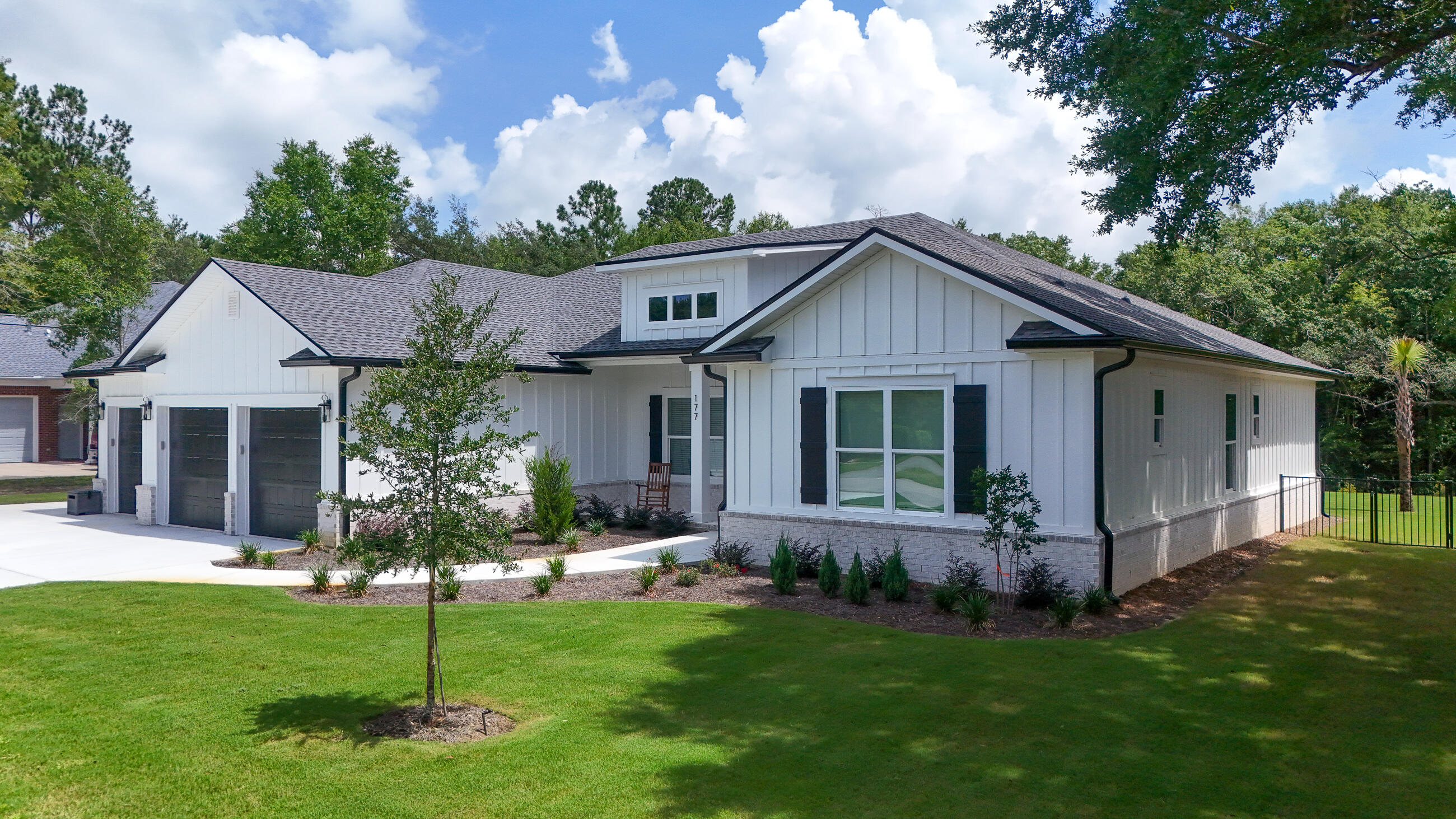 177 Harmony Way Freeport, FL 32439 - Photo 2 of 87 a front view of house with a garden