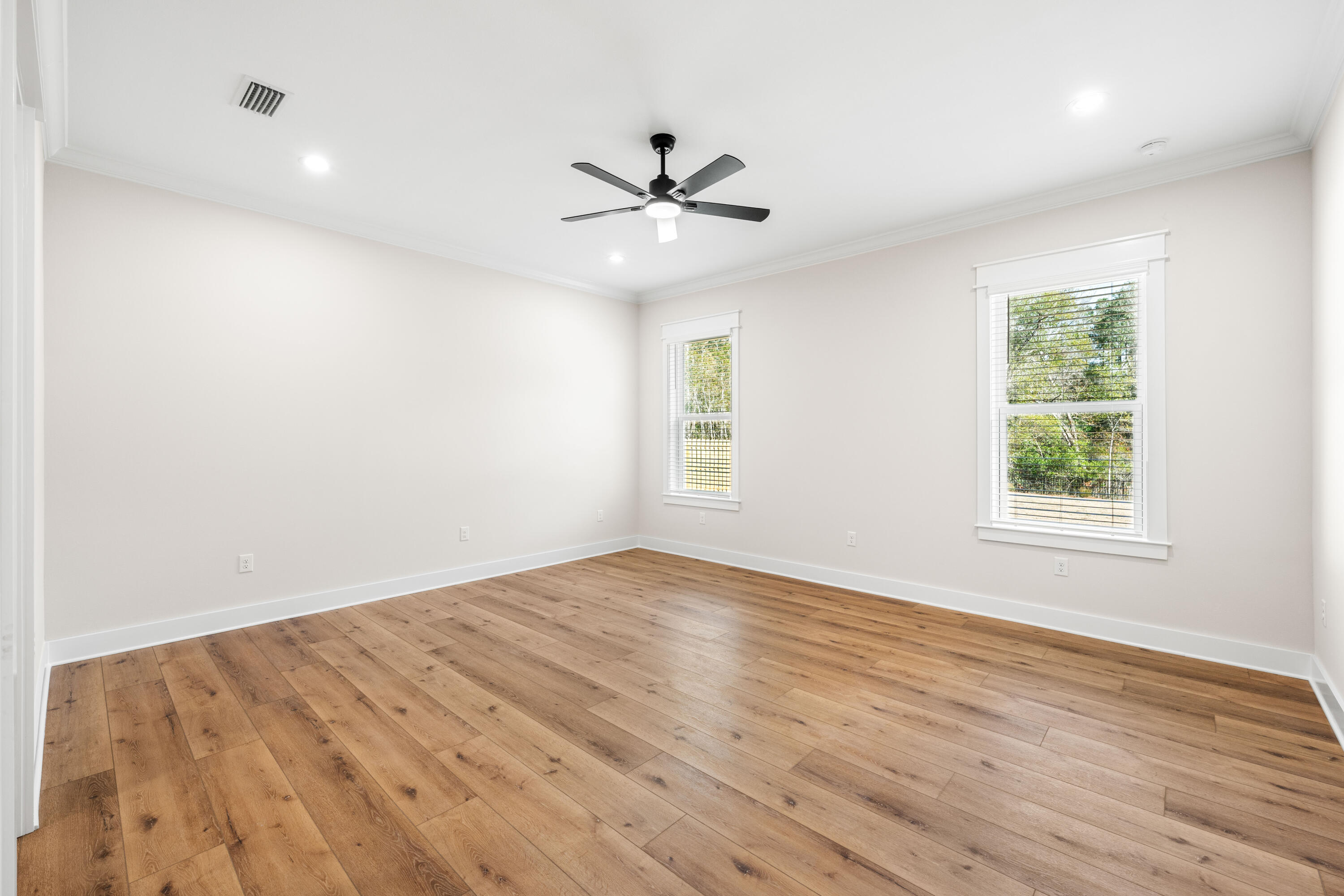 177 Harmony Way Freeport, FL 32439 - Photo 27 of 87 wooden floor in an empty room with a window