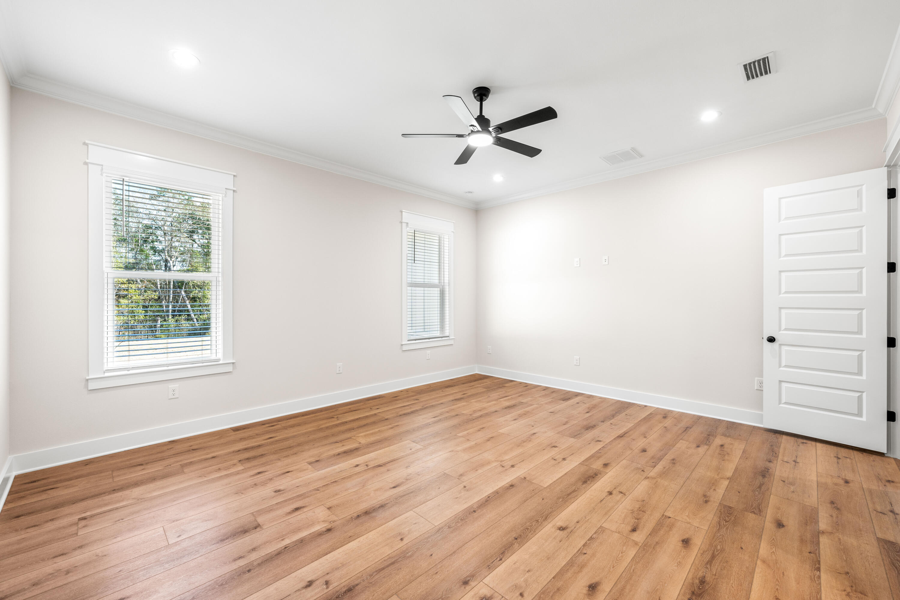 177 Harmony Way Freeport, FL 32439 - Photo 29 of 87 wooden floor in an empty room with a window