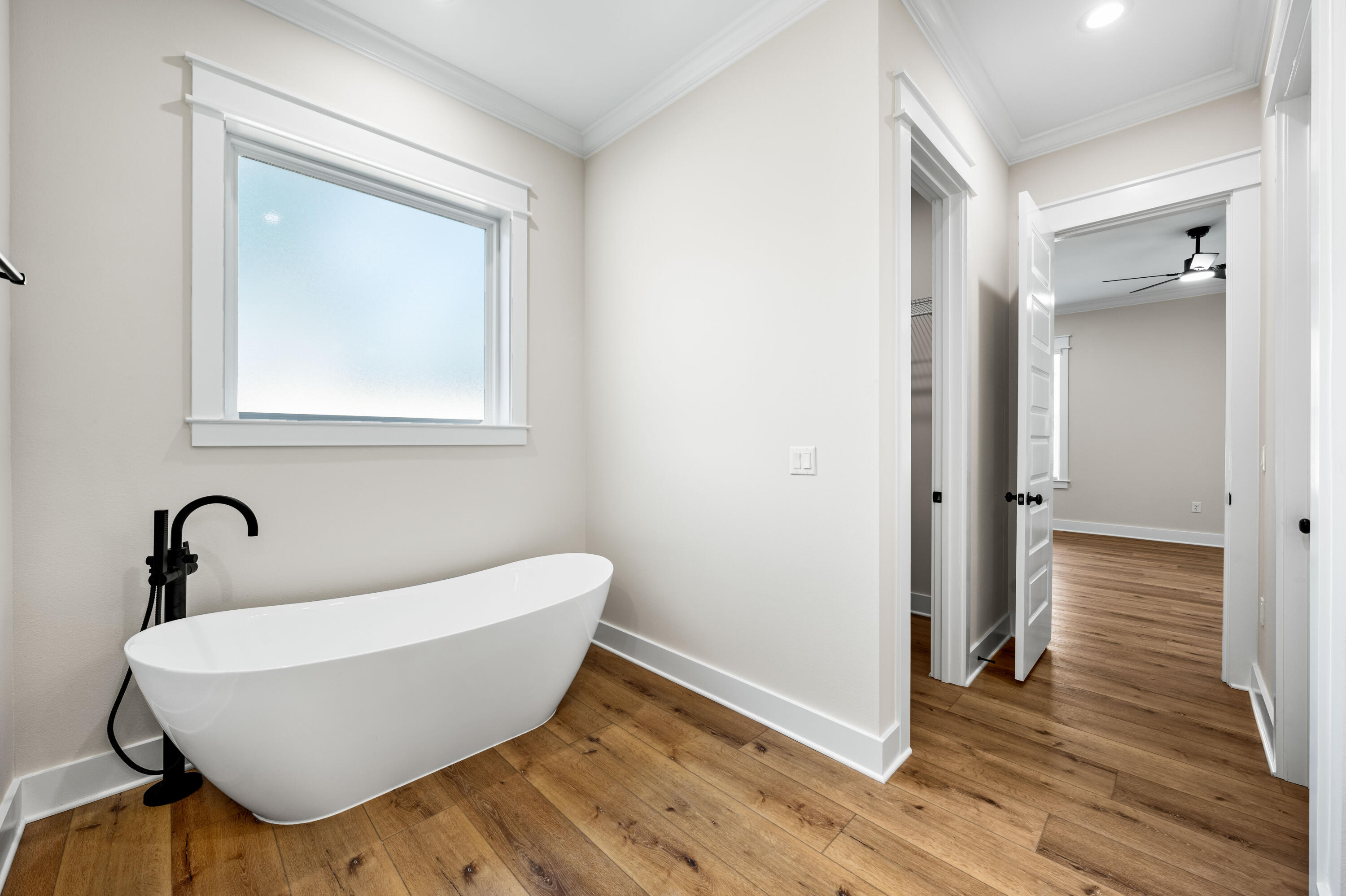 177 Harmony Way Freeport, FL 32439 - Photo 33 of 87 a bathroom with a bathtub and a sink