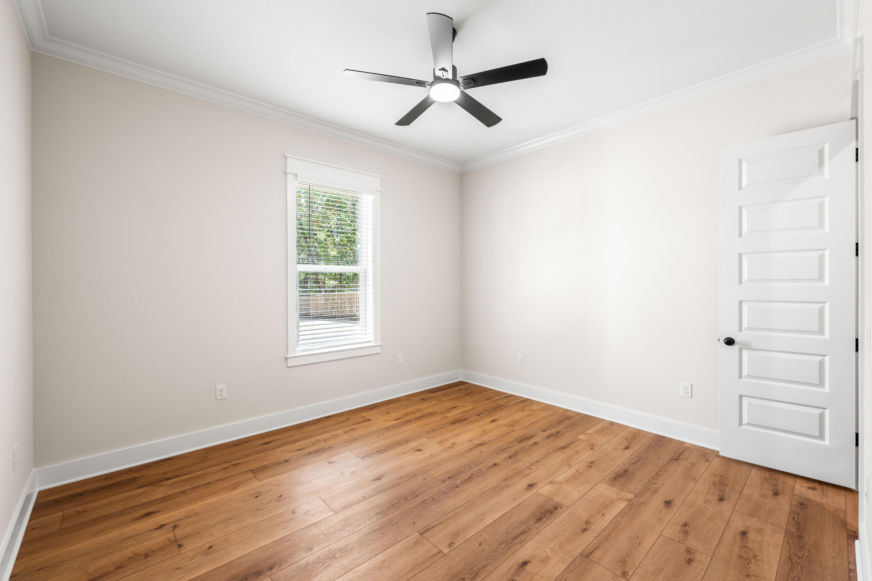 177 Harmony Way Freeport, FL 32439 - Photo 36 of 87 a view of empty room with wooden floor and fan