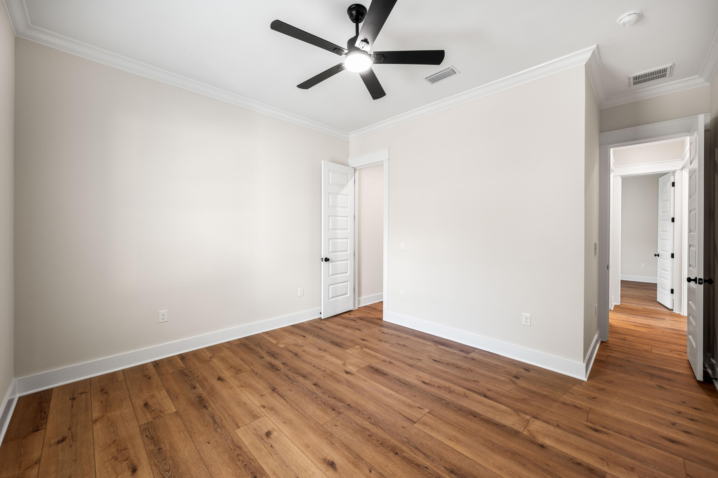 177 Harmony Way Freeport, FL 32439 - Photo 37 of 87 wooden floor in an empty room