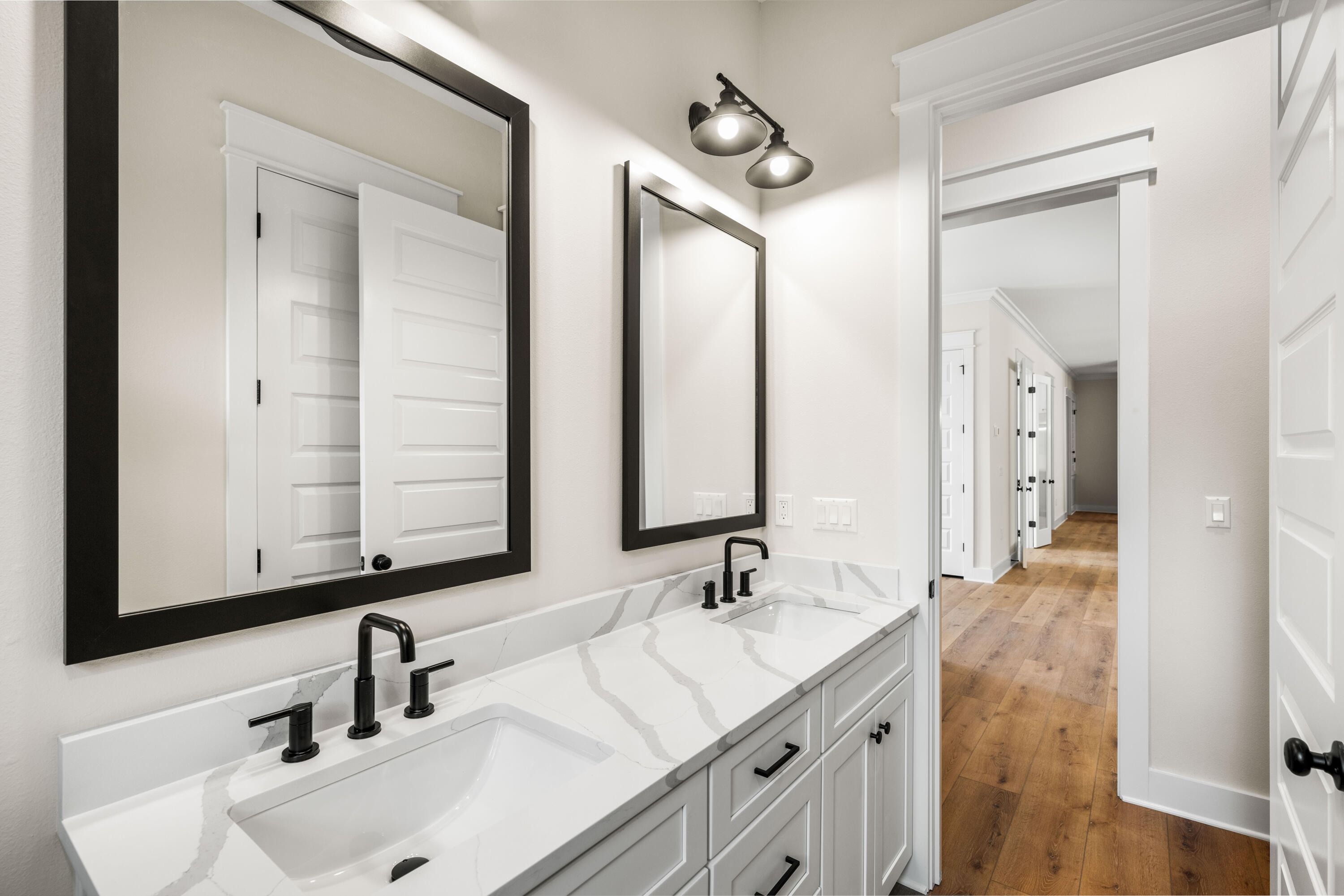 177 Harmony Way Freeport, FL 32439 - Photo 41 of 87 a bathroom with 2 sink and a mirror