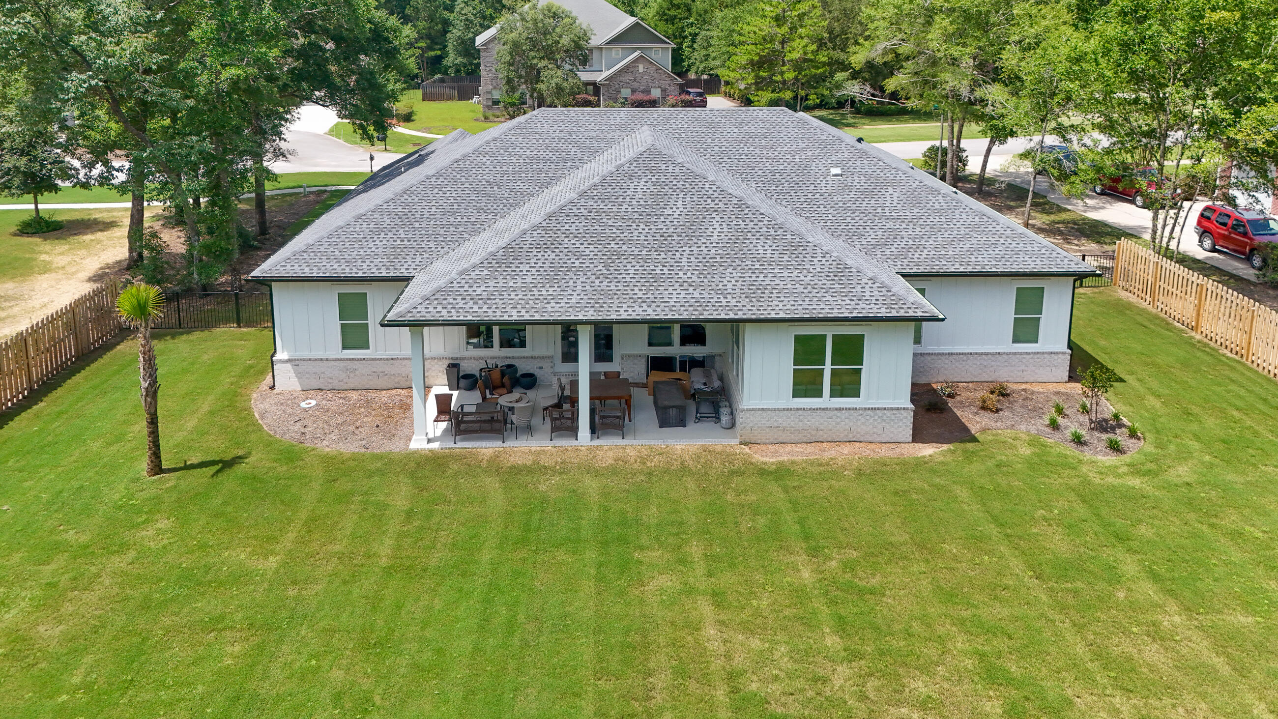 177 Harmony Way Freeport, FL 32439 - Photo 49 of 87 a view of a house with a yard and sitting area
