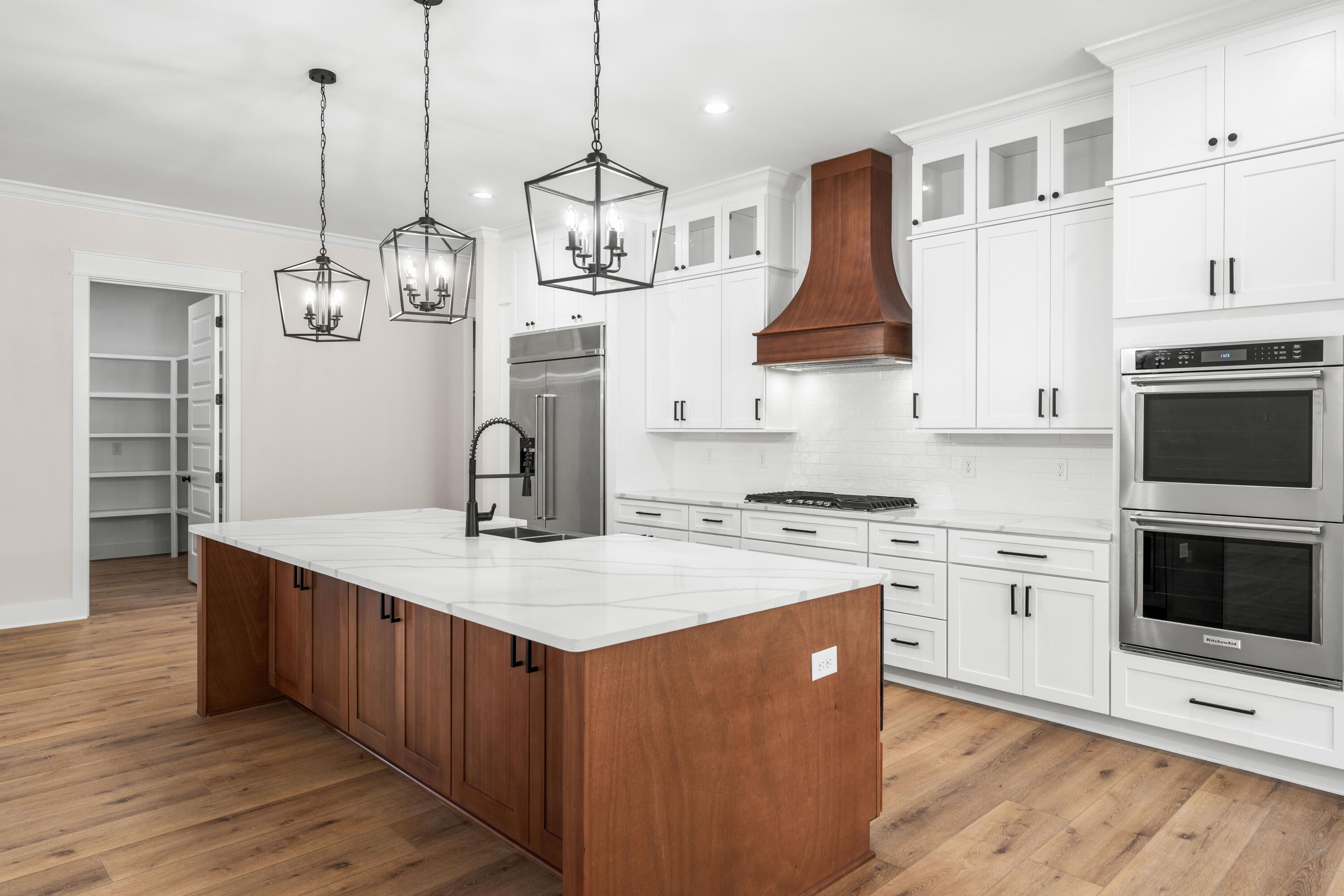 177 Harmony Way Freeport, FL 32439 - Photo 8 of 87 a kitchen with stainless steel appliances granite countertop a stove a sink dishwasher and a refrigerator with wooden floor